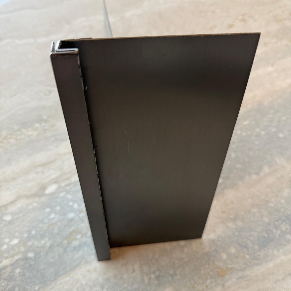 Black stainless steel skirting profile, 0.8mm thick, 10cm width, designed for wall panels and profiles by BEACON.