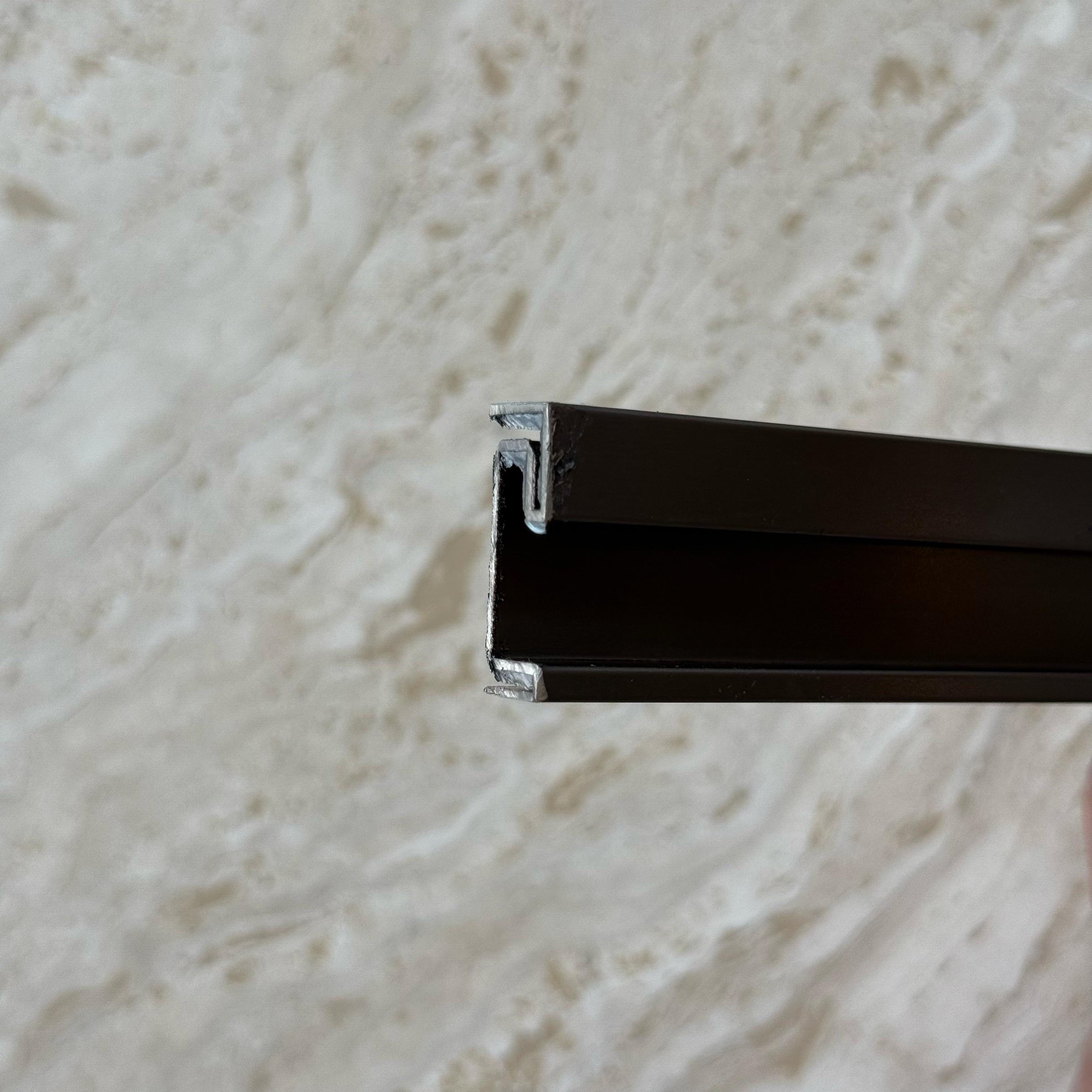 Black stainless steel skirting profile, 0.8mm thick, 2.5cm height, designed for wall panels and profiles by BEACON.