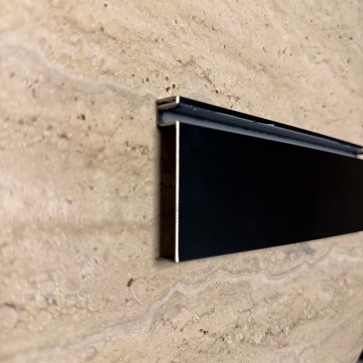 Black 0.8mm thickness 6cm skirting profile from BEACON wall panels and profiles collection.