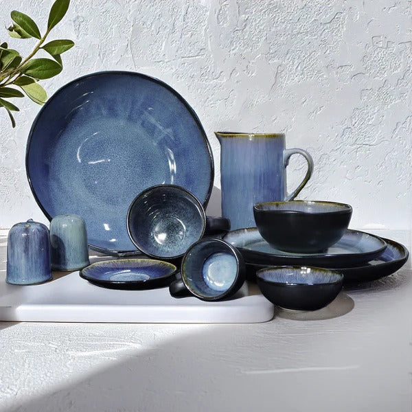 38-piece Blue Wave dinnerware set by BEACON featuring plates, bowls, and mugs with a blue wave design.