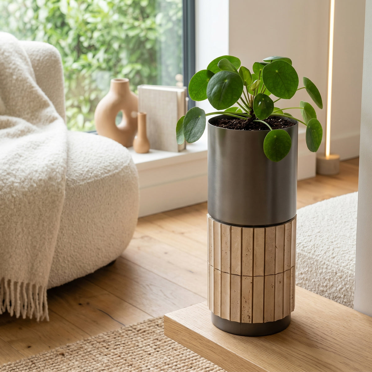 Urban Terra cylinder planter box by ebarza, sleek outdoor container with a textured finish, ideal for plants and greenery.