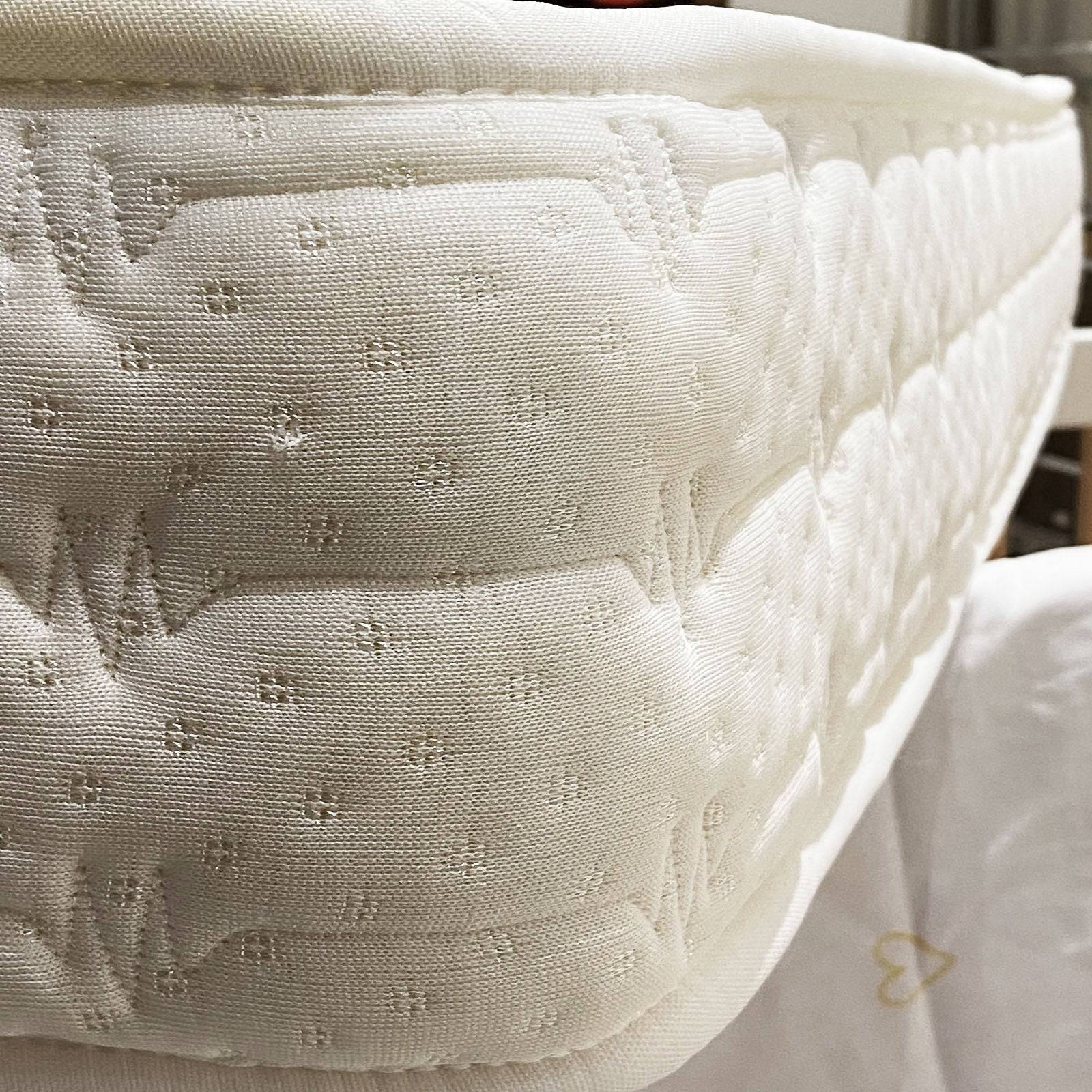 Indivani 60x120 cm baby crib mattress with soft, supportive surface for infant comfort and safety in a nursery setting.