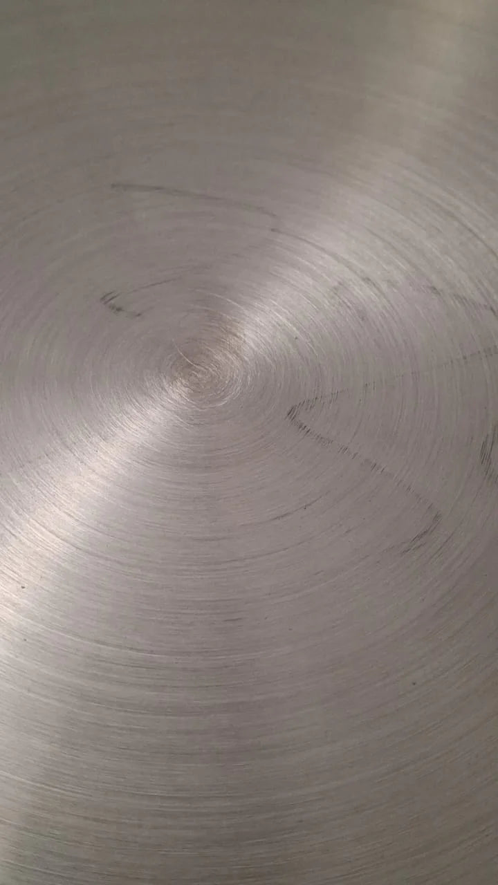 Handcrafted stainless steel artwork display by BEACON, showcasing intricate metal craftsmanship and modern design.