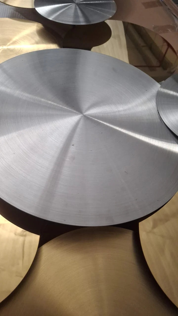 Handcrafted stainless steel artwork display by BEACON, featuring intricate metal design and polished finish.