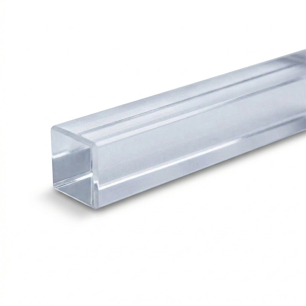 A clear acrylic square door handle with smooth edges, designed for modern interior doors, by BEACON.