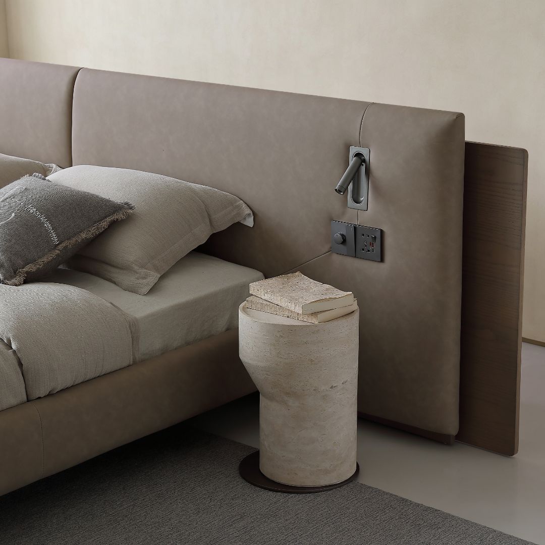 Amorph King Size Bed by BEACON, sturdy wooden bedstead with a modern design, shown in a well-lit bedroom setting.