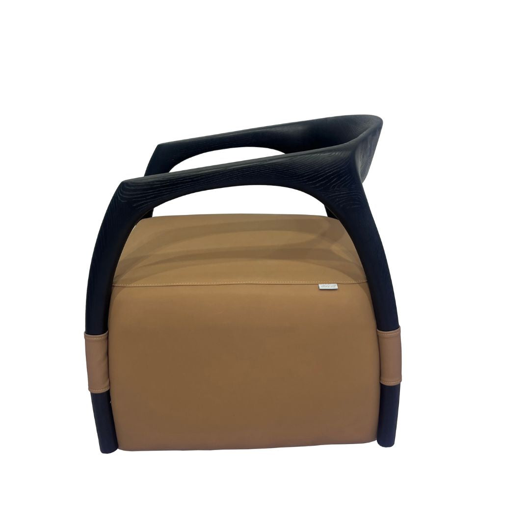 BEACON Dune armchair with sleek design, plush fabric upholstery, and modern style, shown in a cozy living room setting.