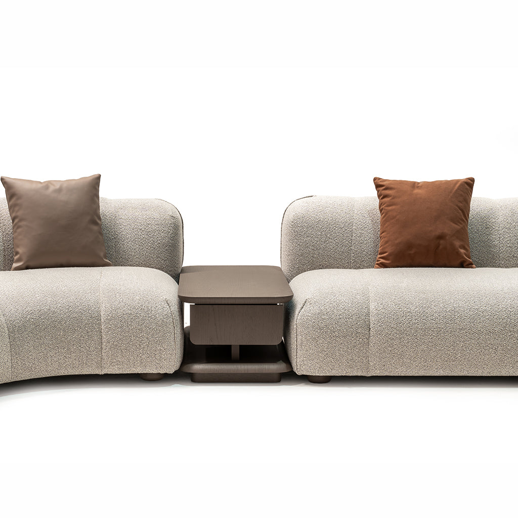 Bold corner sofa with matching coffee table by HOMAGE KOLTUK, featuring plush cushions and modern design in a living room setting.