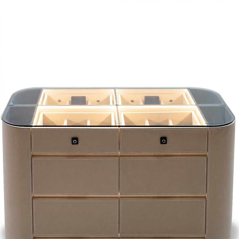 Valmont center island dresser with bench from BEACON, featuring a modern cabinet design and a matching seating area.