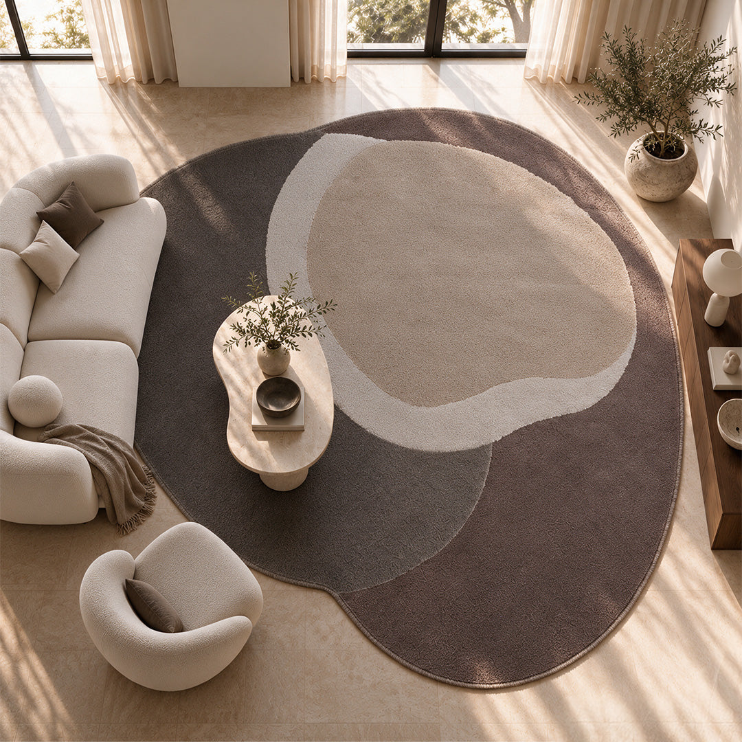 Handmade round rug by COOL HALI in warm brown tones, measuring 380x315 cm, with textured woven pattern.