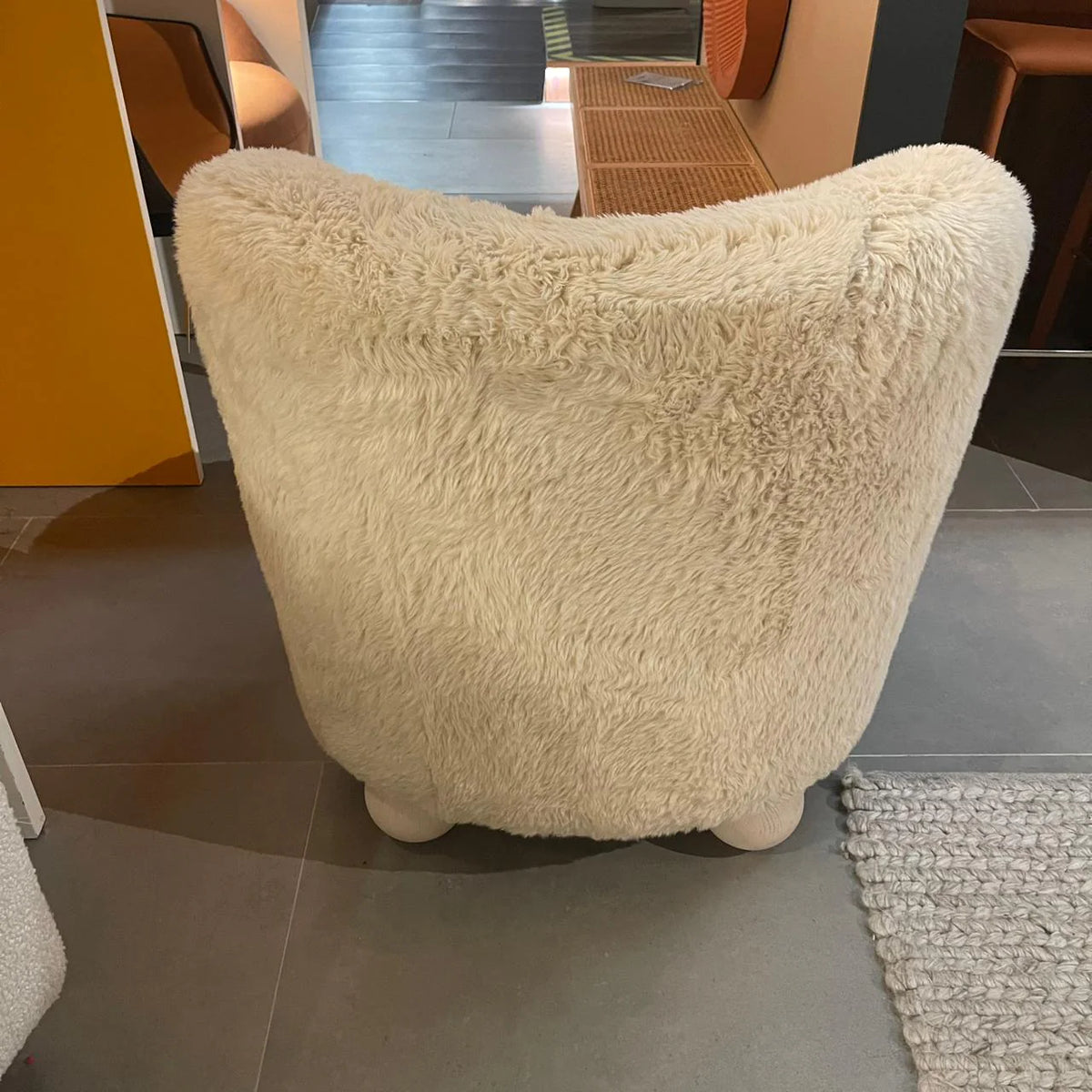 Ivory ball-foot accent chair from Sagebrook Home, showcasing a stylish modern design with a round base and plush upholstery.