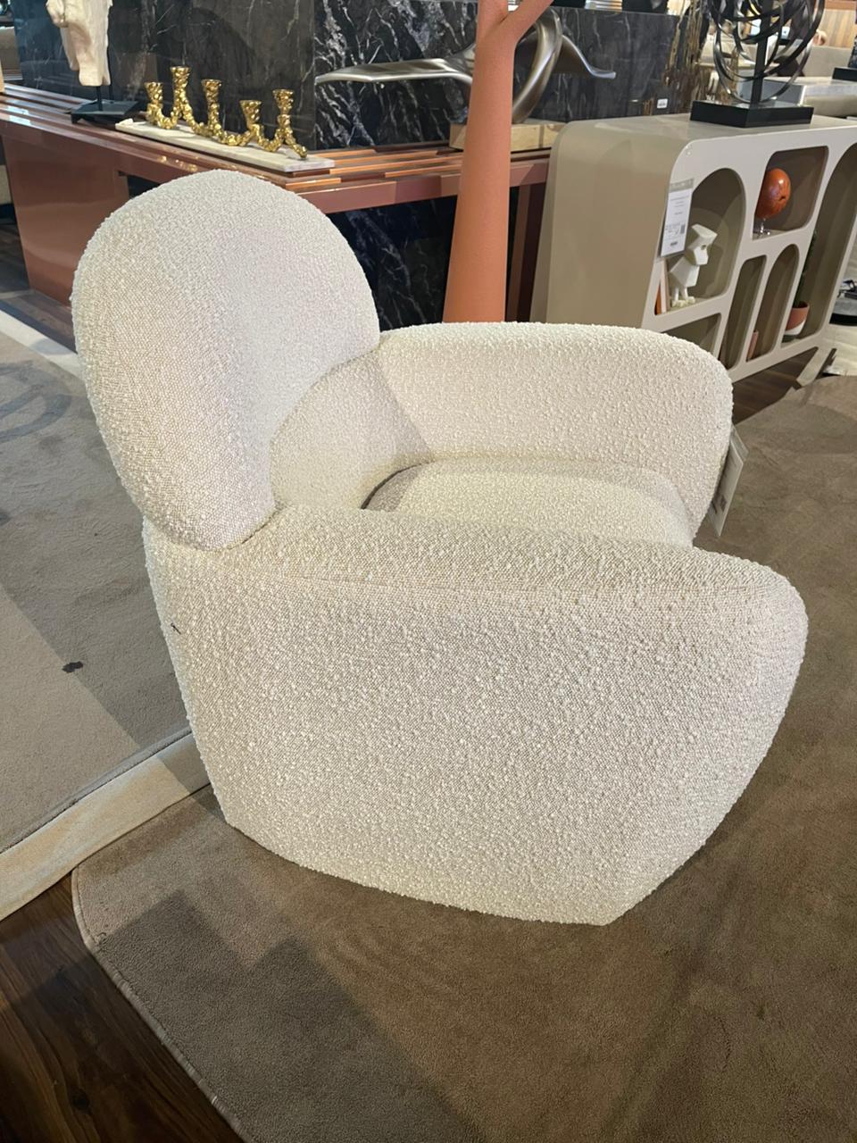 Display of Sagebrook Home Club Accent Arm Chair with plush upholstery and wooden legs, showcasing its stylish design.