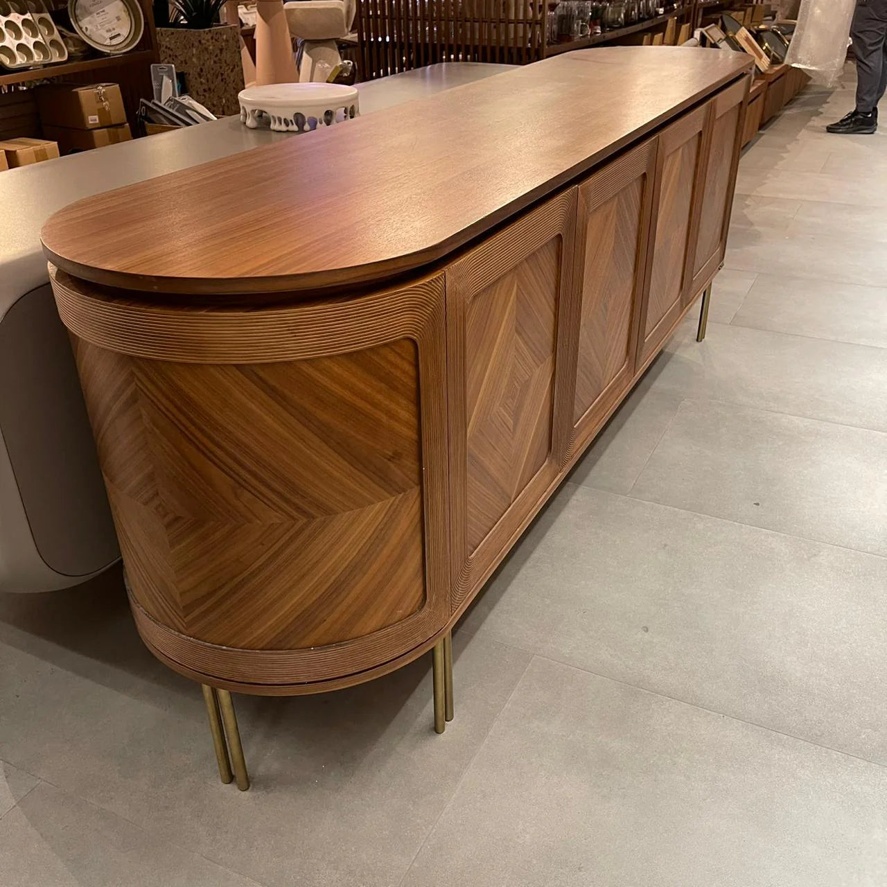 Display of LODA Furniture Eva sideboard with a sleek veneer top, showcasing its modern design and wood finish.