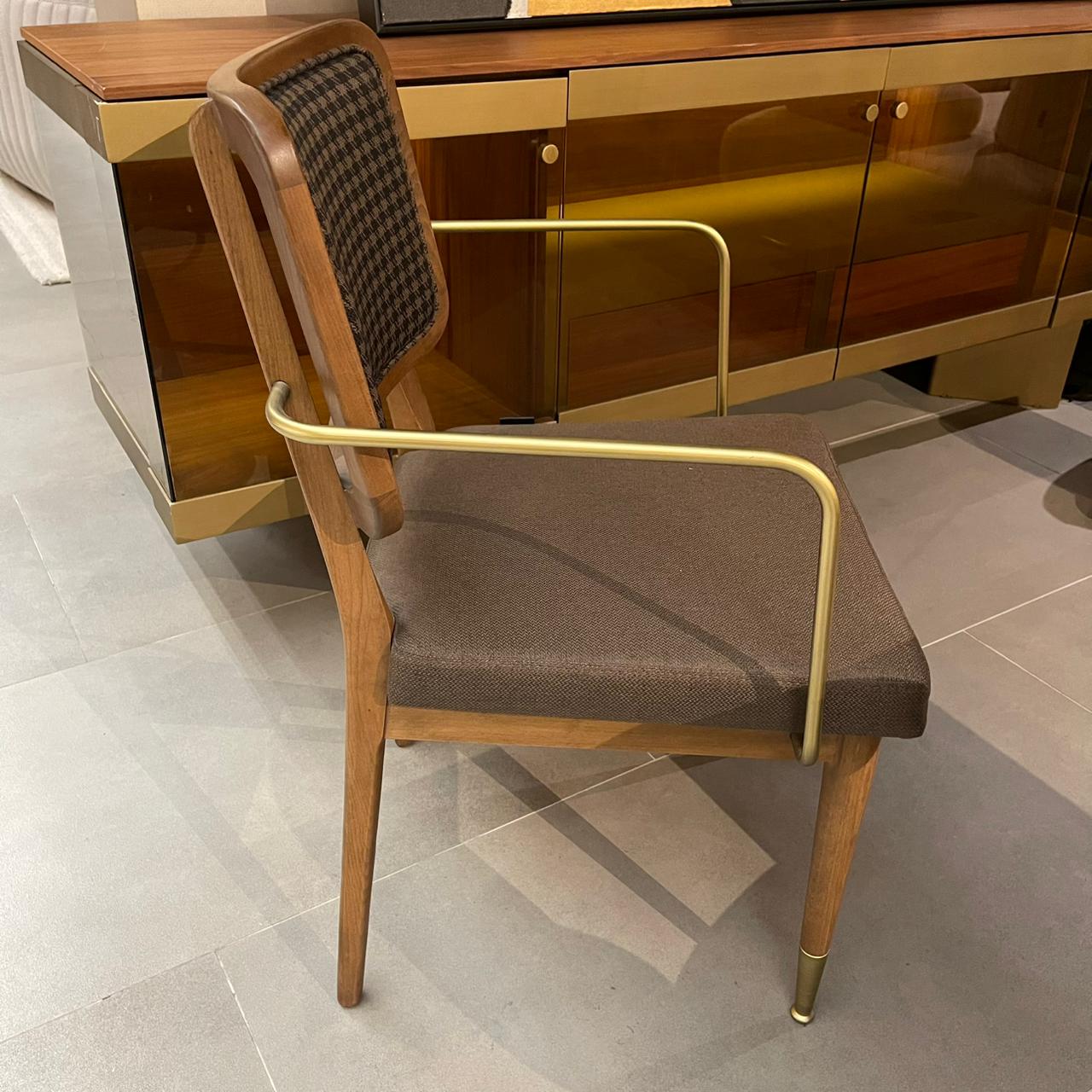 Display of a Soho-Gold dining chair from LODA Furniture with a sleek gold finish and modern design.