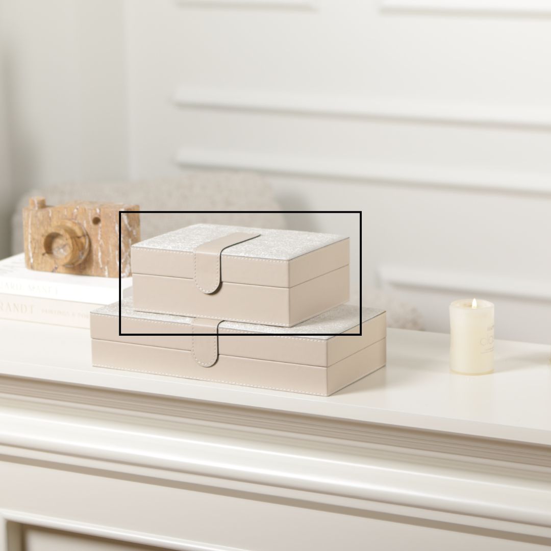 Hinged leather jewelry box by BEACON with decorative design and secure closure, ideal for organizing jewelry and accessories.