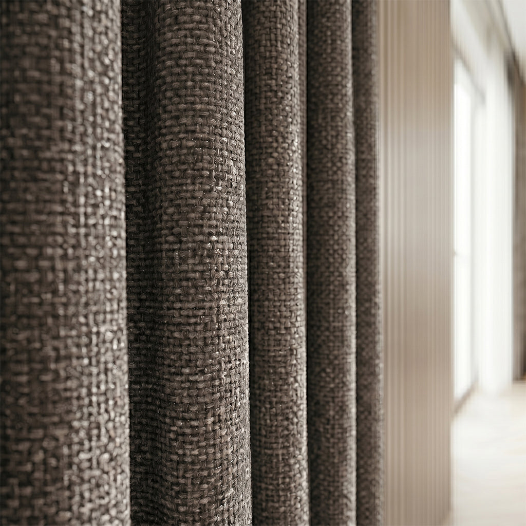 Close-up of BEACON Hush polyester curtain fabric in a neutral color, showcasing smooth texture and detailed weave pattern.