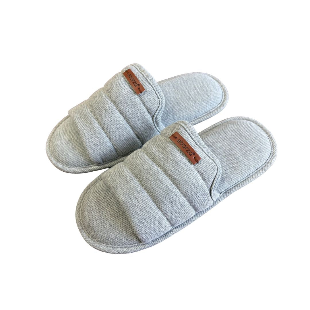 Light grey women’s slippers from BEACON JRDG, plush comfort, soft fabric, and casual slip-on style.