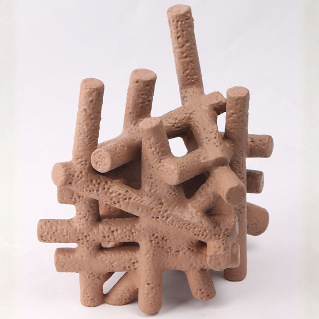 Muddy red BEACON interlocking forms home decor figurines with textured clay appearance, arranged in an artistic display.
