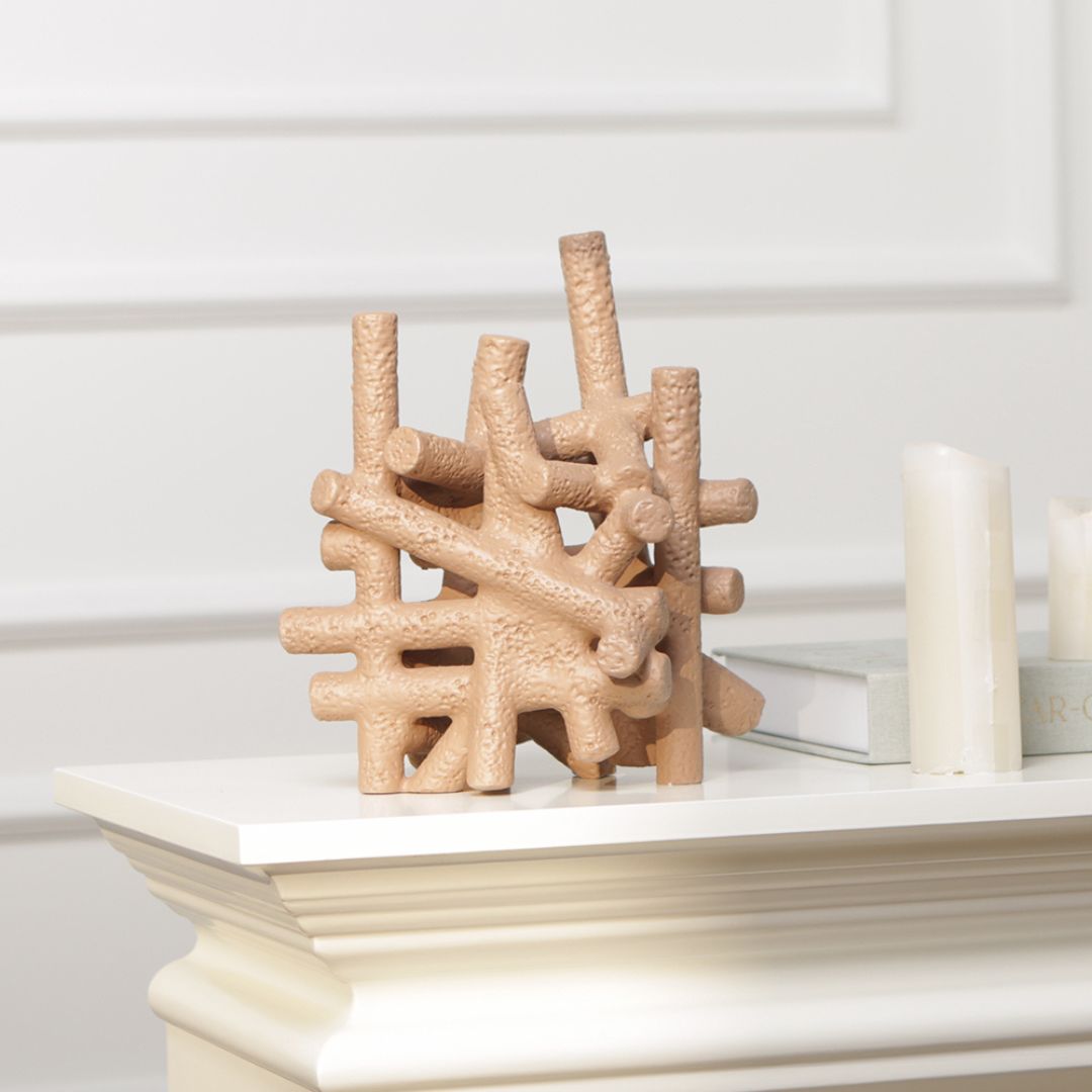 Muddy red interlocking forms figurine by BEACON, modern home decor sculpture with geometric design and textured finish.