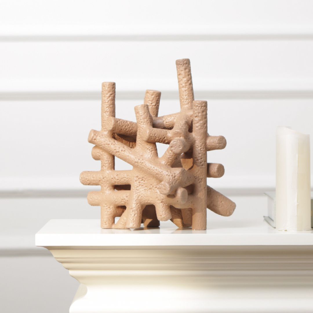 Muddy red BEACON interlocking forms home decor figurines, abstract sculpture with geometric shapes and textured surface.