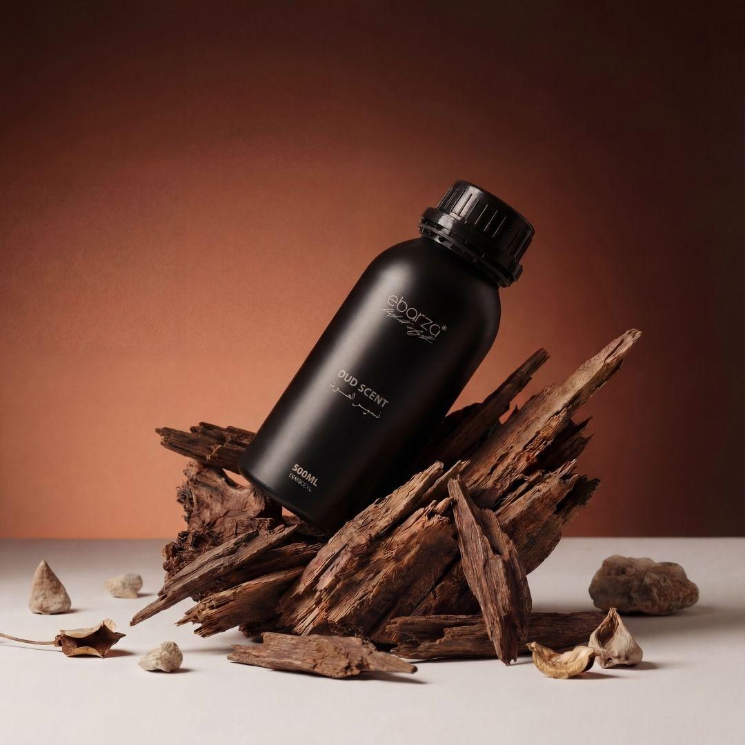 Bottle of BEACON Oud Scent Essential Oil in a 500ml dark glass container, with a black cap and label showing product details.