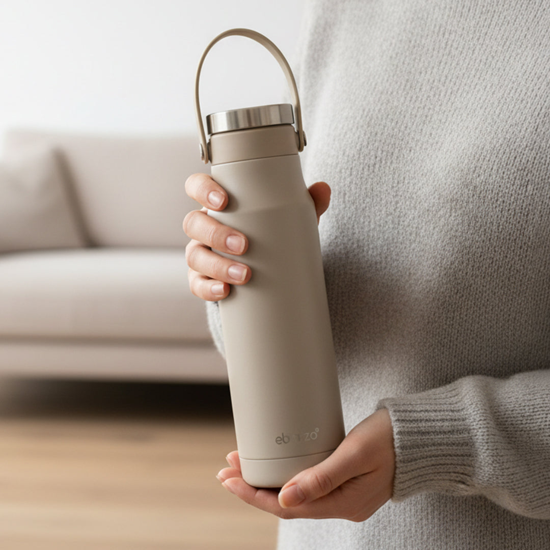 Celadon 700ml drinkware bottle by BEACON with a sleek ceramic design and secure lid, perfect for beverages.
