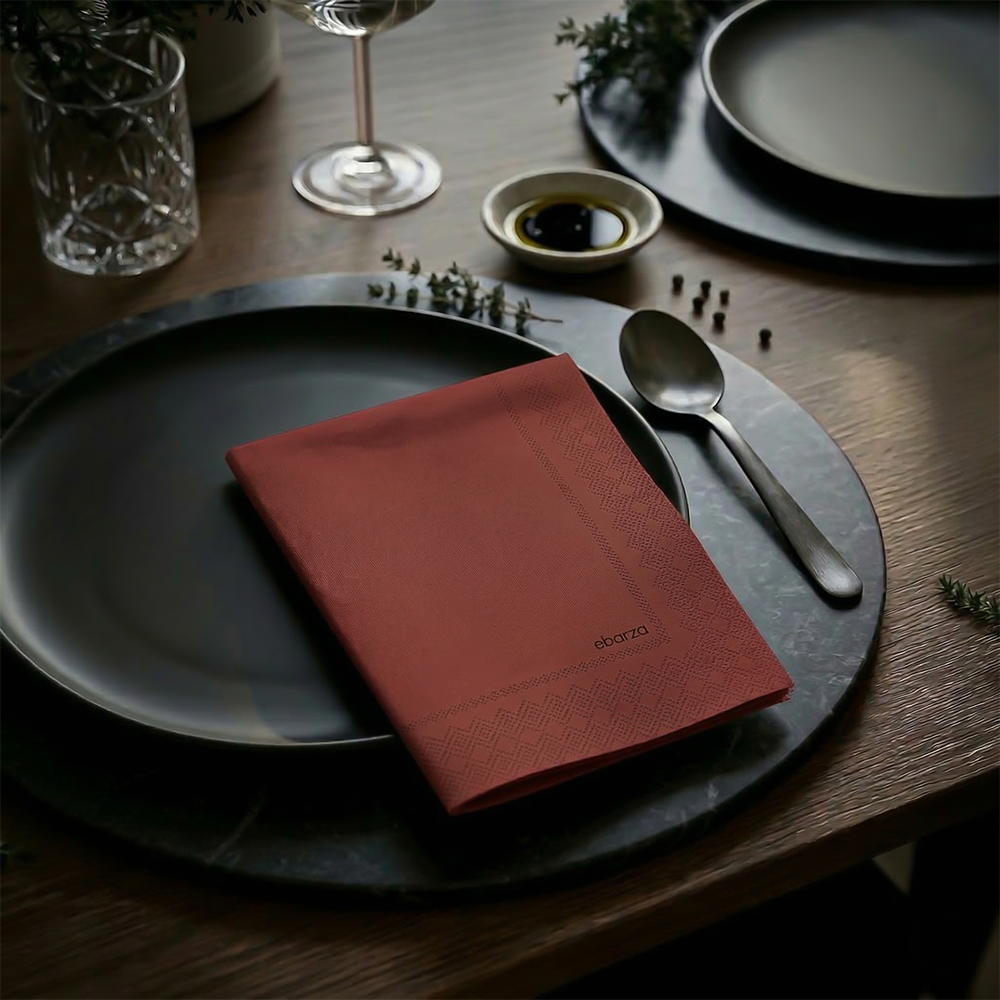 Printed paper napkin from DNFDG-22353 brand with colorful printed design, shown folded on a plain background.