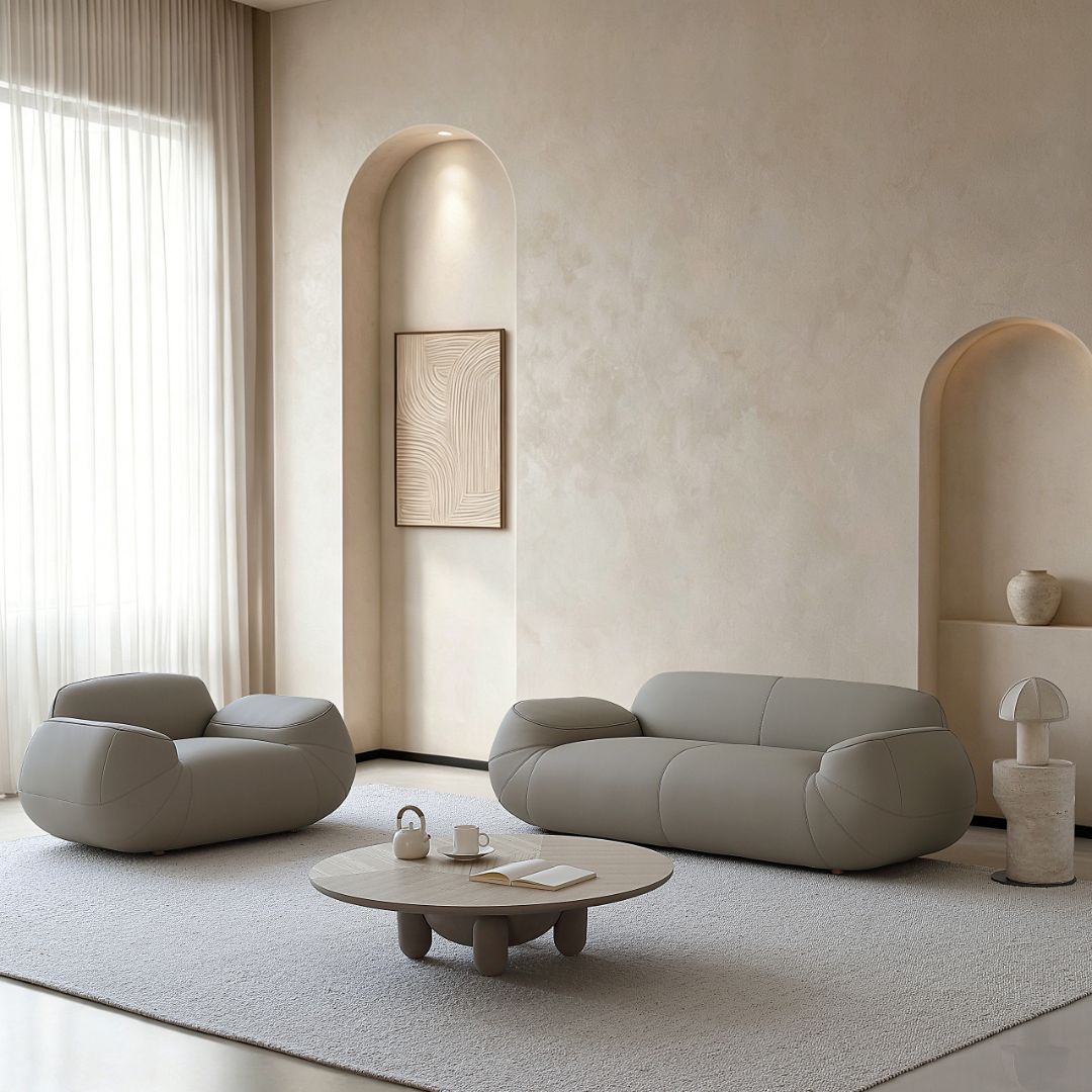 BEACON Rotunda 2-seater sofa with plush fabric and modern design, shown in a cozy living room setting.