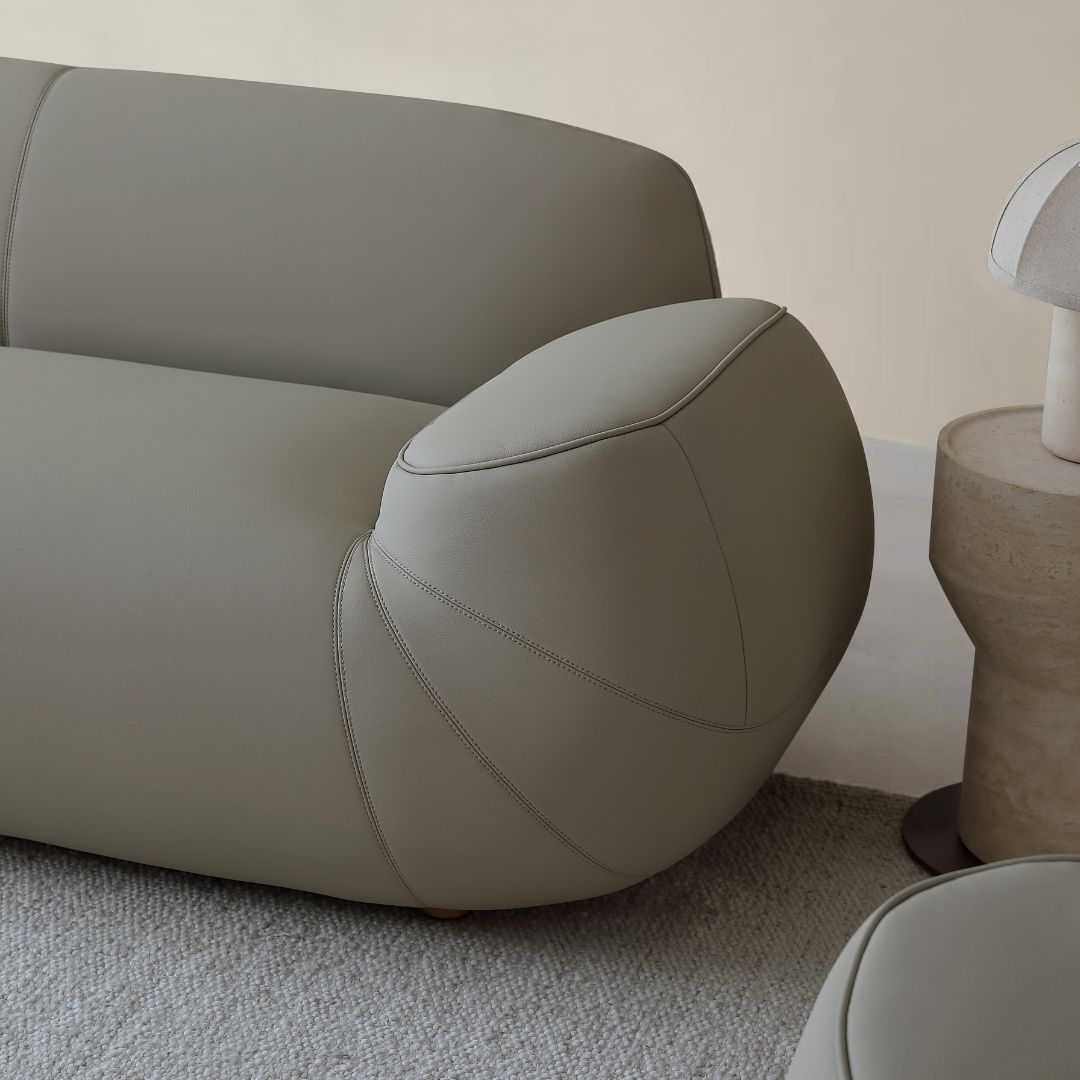 BEACON Rotunda 2-seater sofa in neutral fabric, showcasing plush cushions and modern design for comfortable living space.