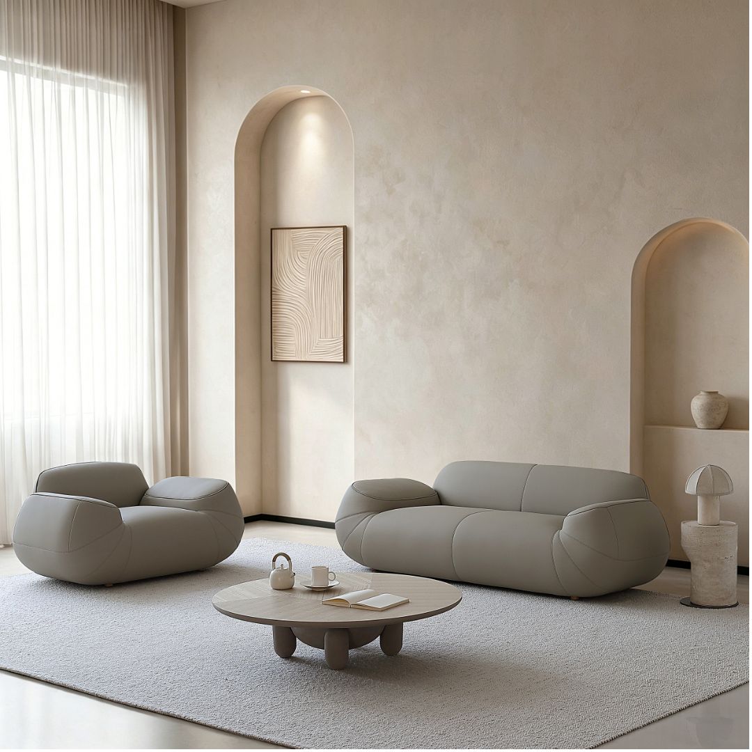 BEACON Rotunda armchair AMCJ-S6102 with plush fabric and curved design, shown from a side angle in a modern living room setting