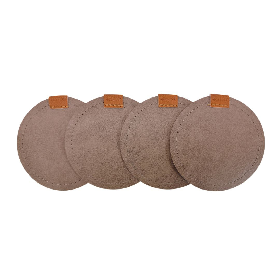 Set of four taupe grey BEACON coasters with a smooth, round design perfect for protecting surfaces.