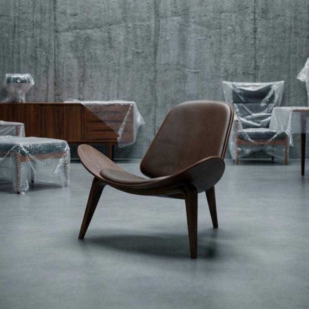 Brown leather and wood Smile Lounge Chair by BEACON, showcasing a stylish and comfortable lounge chair with modern design.