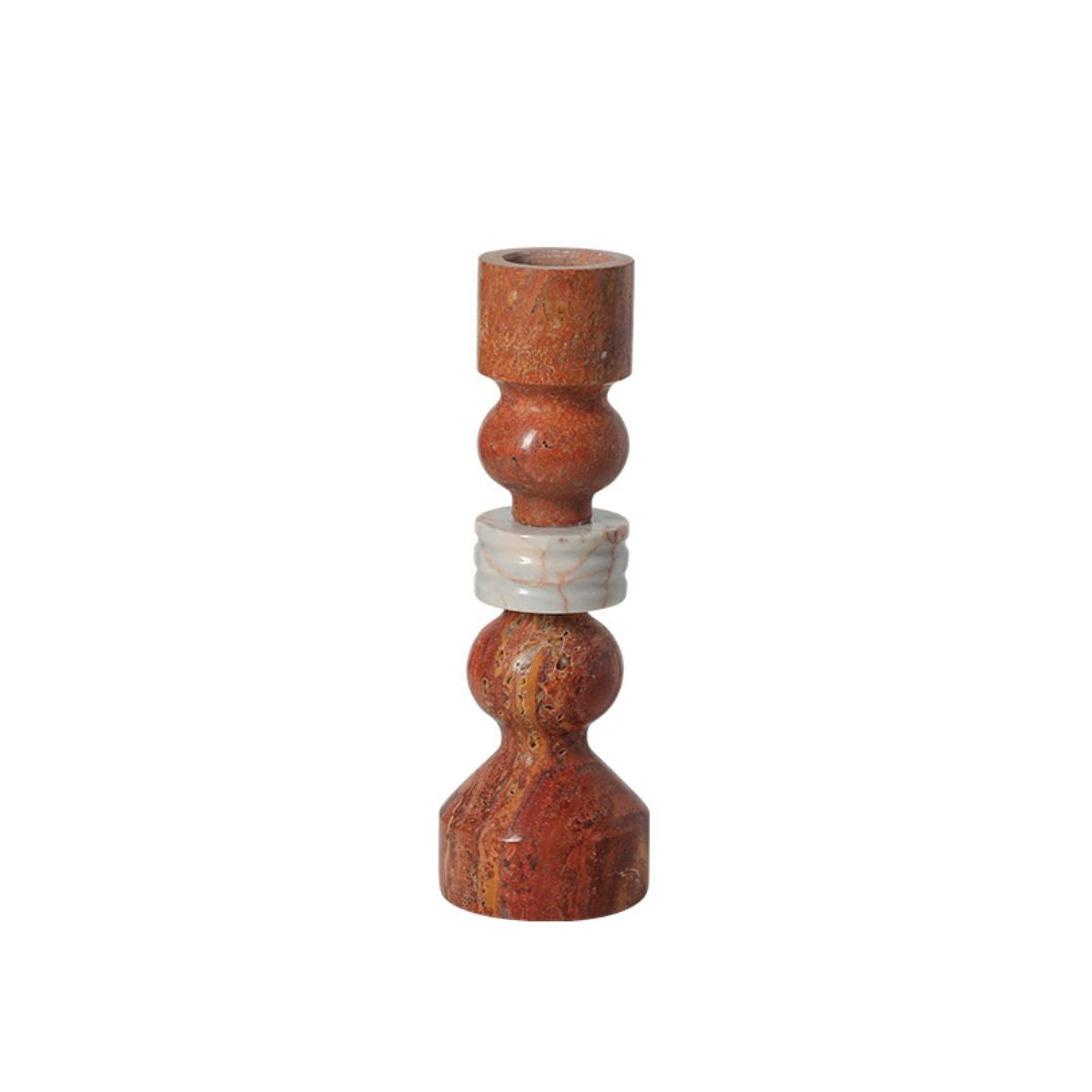 Red stone marble string candle holder from BEACON, featuring a sleek cylindrical design with a hollow center for candles.