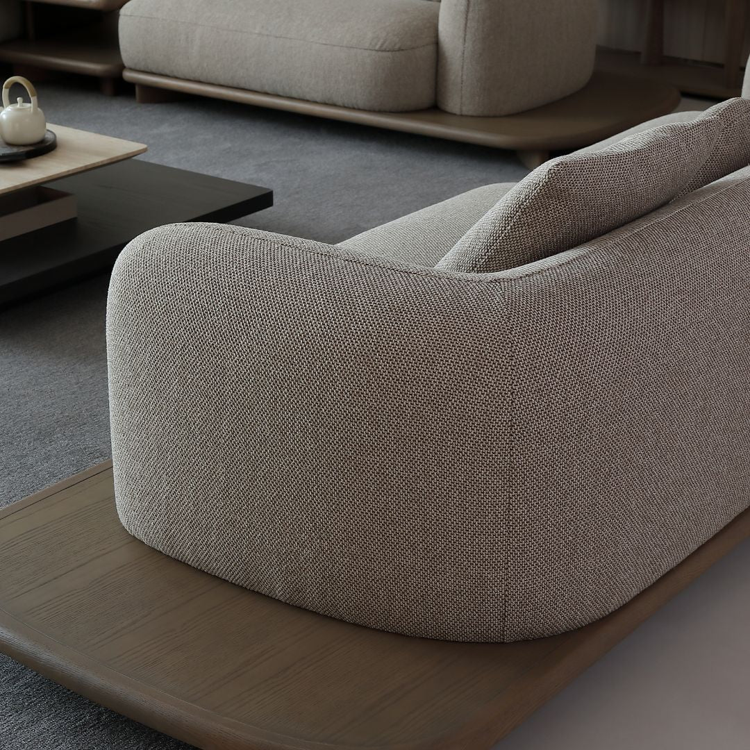 BEACON Umbra sofa with side table, modern design, featuring a sleek seating area and integrated side table in a contemporary style.