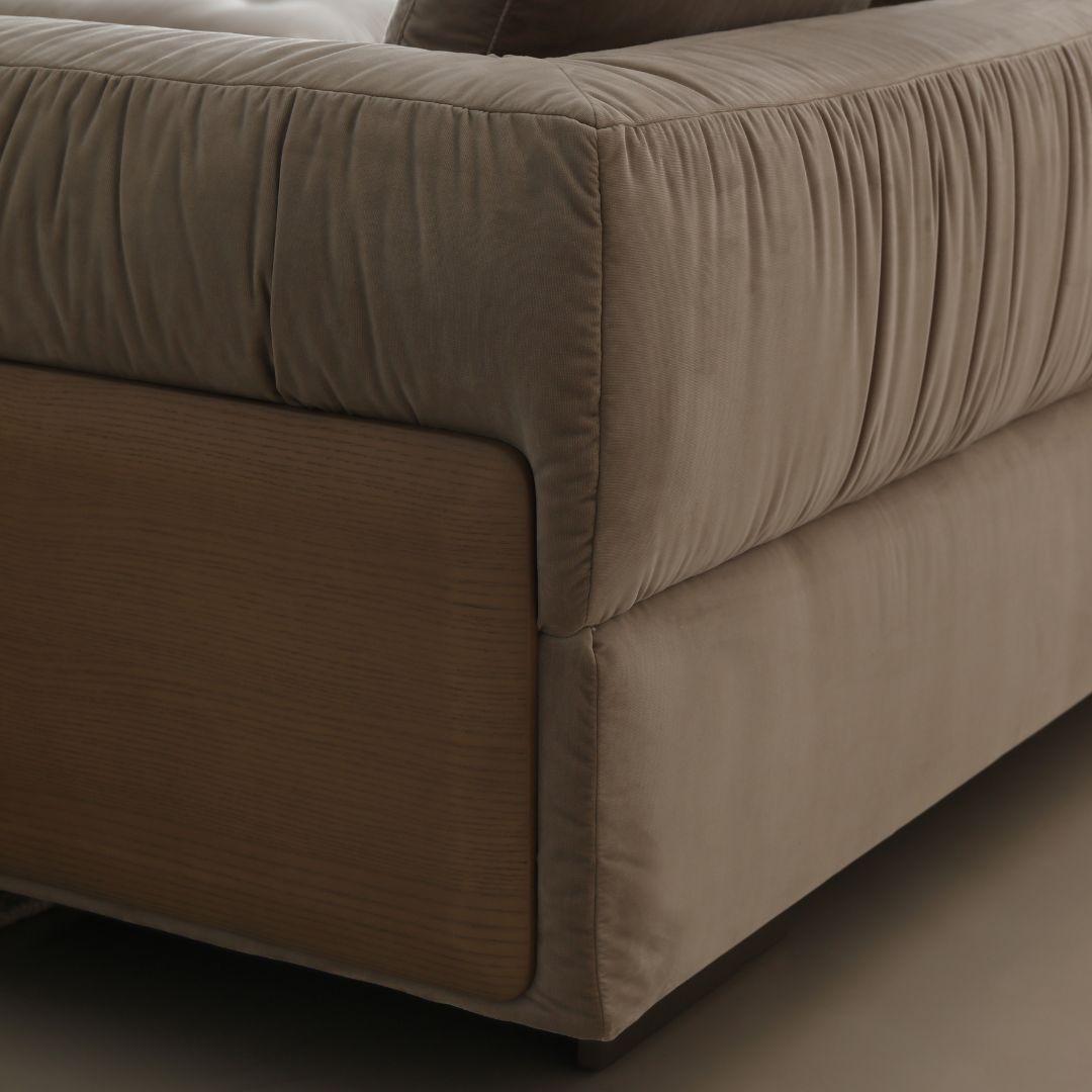 BEACON Volute sofa with matching ottoman in modern design, featuring plush cushions and stylish upholstery.