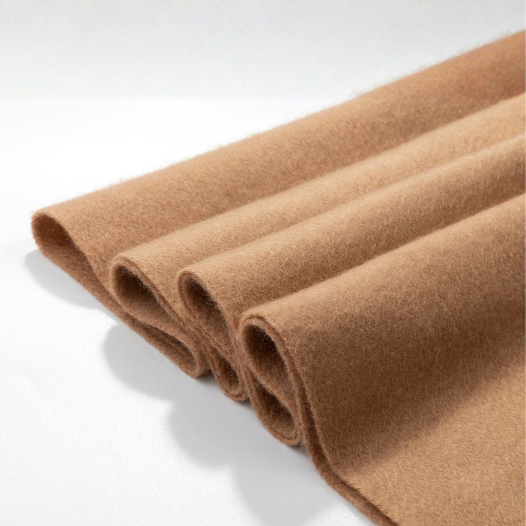 Beige Lana Wool Scarf from BEACON, soft and cozy, draped over a neutral background, showcasing its warmth and texture.