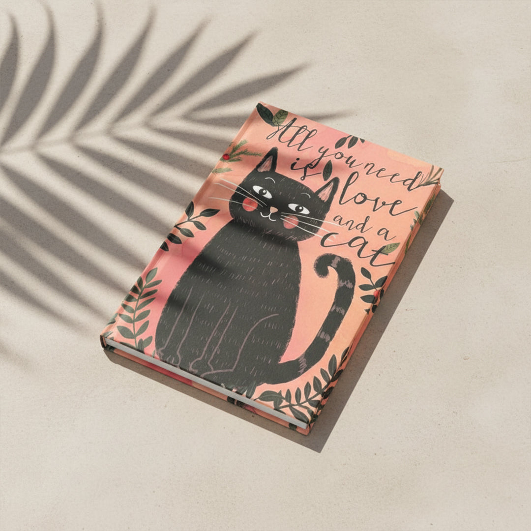 Decorative book titled "All You Need Is Love And A Cat" by BEACON, featuring a colorful cover design.