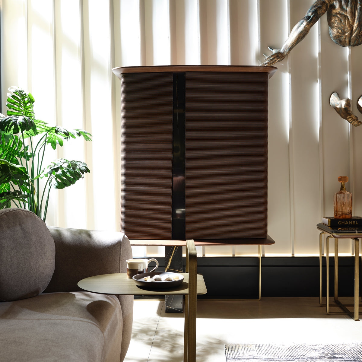 Amber display cabinet by LODA FURNITURE, showcasing glass doors and wooden frame, used as a stylish showcase or storage piece.