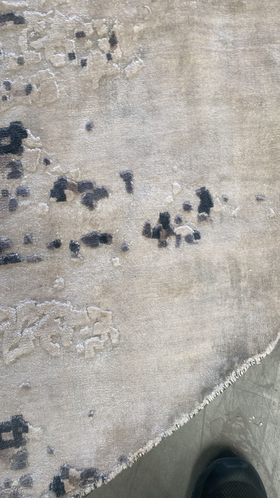 Round handmade wool rug by Javi, 250 cm diameter, displayed as-is, showcasing its textured, natural wool surface and craftsmanship.