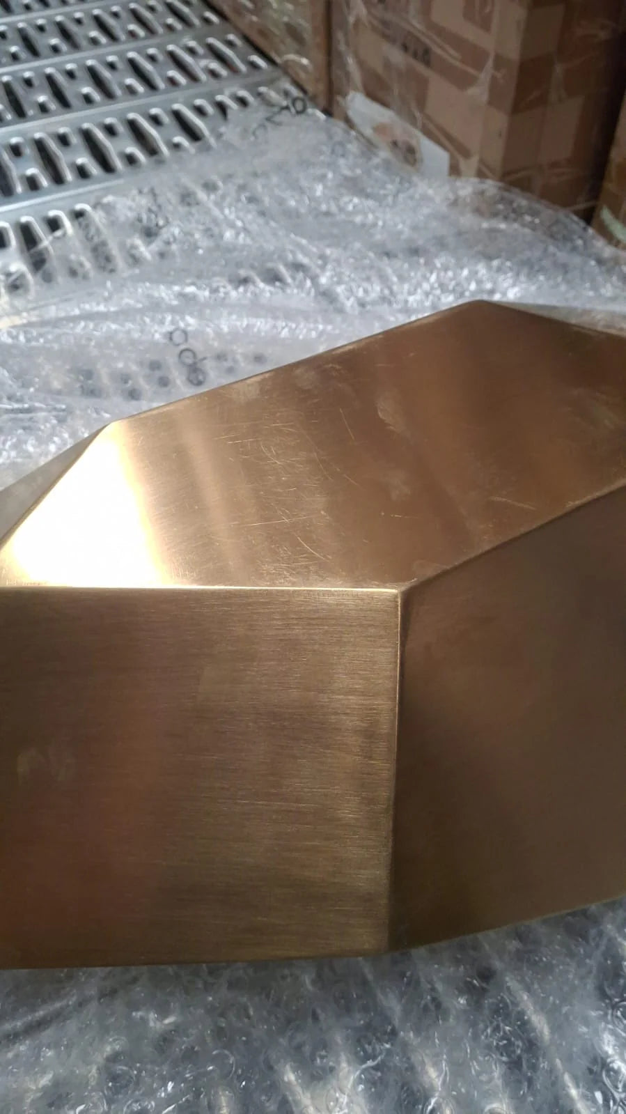 Handcrafted stainless steel diamond-shaped table artwork by Beacon, displayed as an elegant decorative display item.