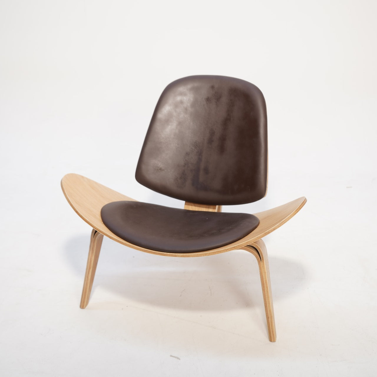 As-is Smile Lounge Chair by BEACON, display item with modern design and cushioned seat, shown in a minimalistic setting.