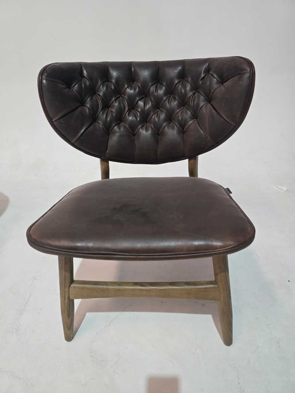 Vintage brown Flora Lounge Chair by Ozzo, displayed as-is with a pull-up leather finish and stylish design.