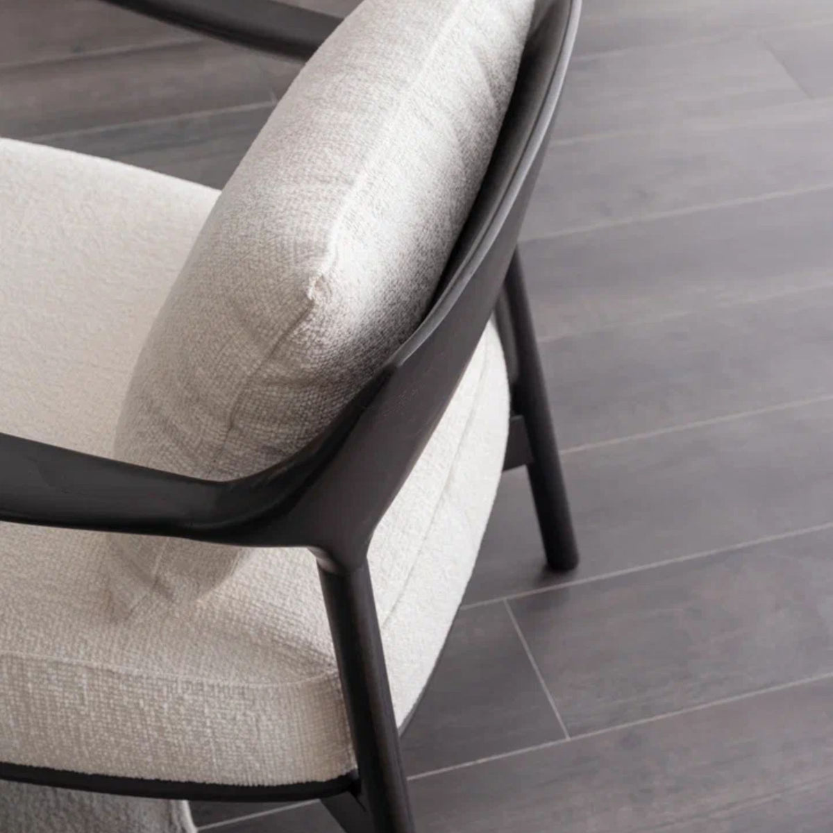 AS IS Grande wooden lounge chair by ORIX, display item with a sleek wooden frame and comfortable seating, showing wear and signs of use.