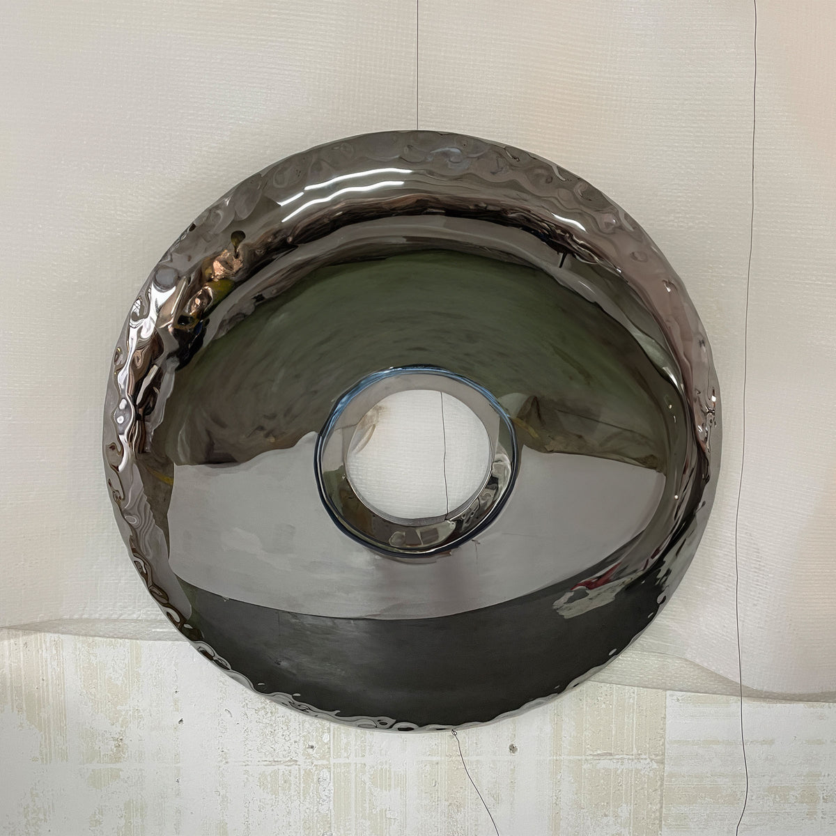 Handcrafted stainless steel artwork with specular color finish by BEACON, showcasing modern abstract design.