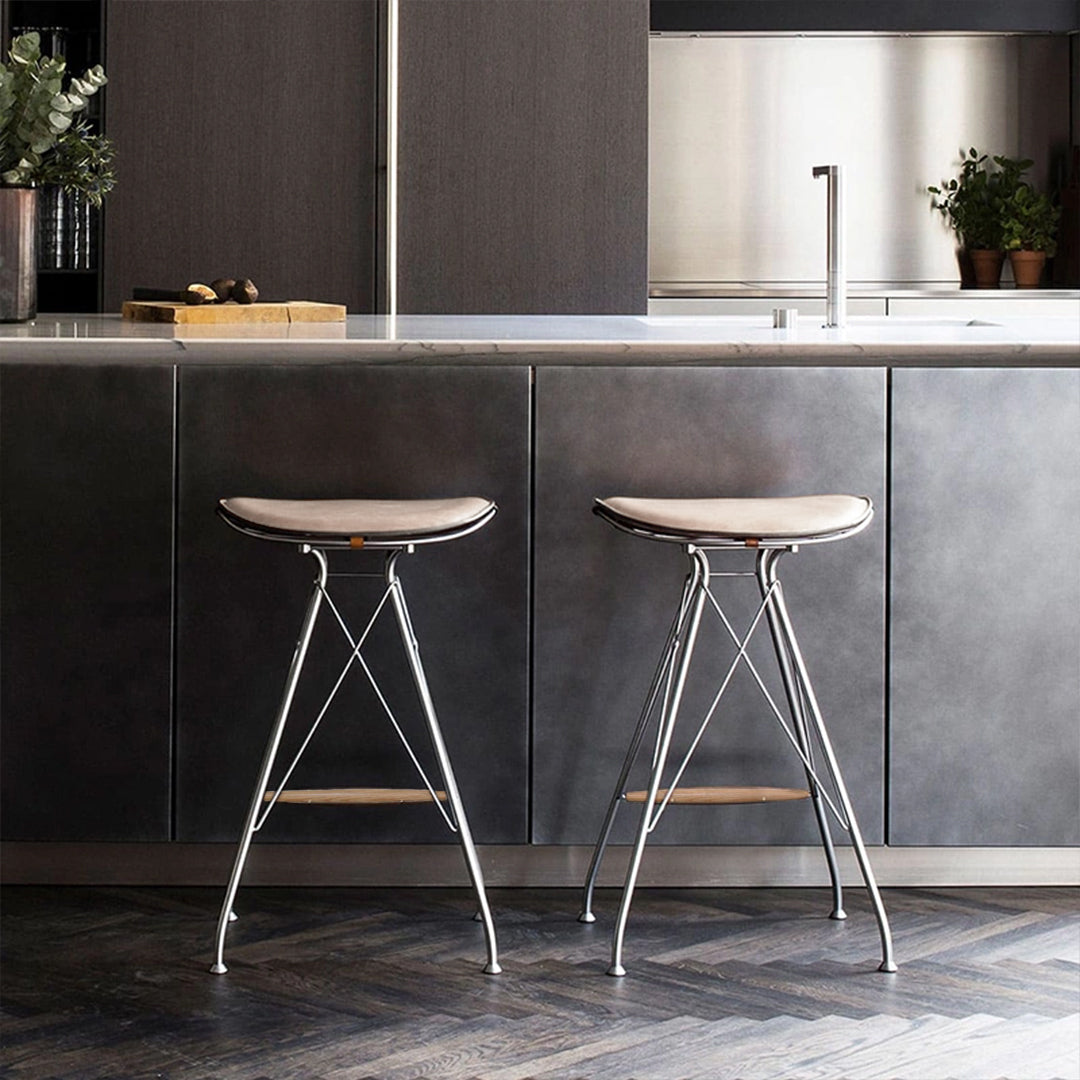 Saddle leather BEACON bar stool PS-B162 with wooden legs, featuring a curved seat and backrest for comfortable seating.