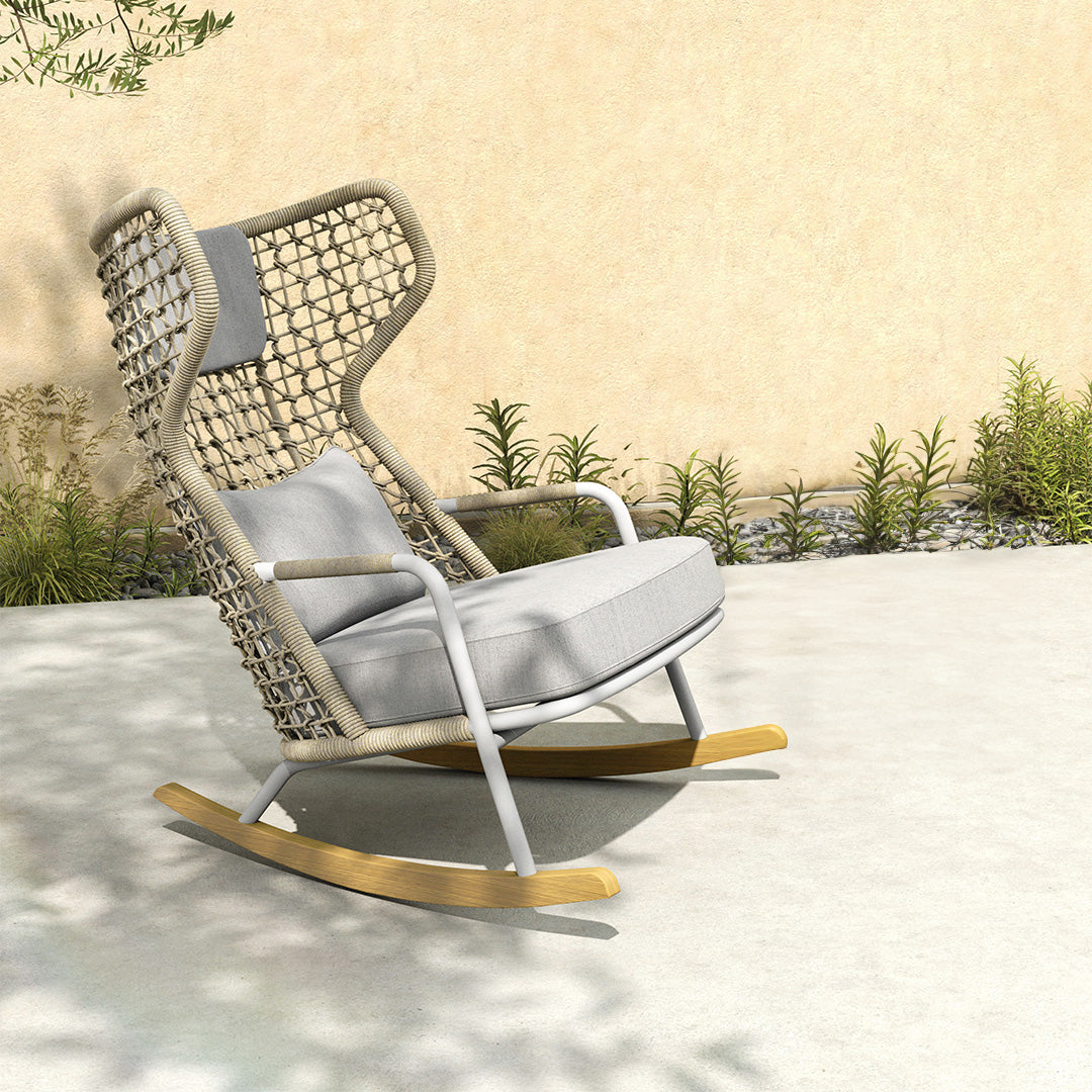 BEACON Banyan outdoor and indoor rocking armchair with wooden frame and cushioned seat, modern design for versatile seating.
