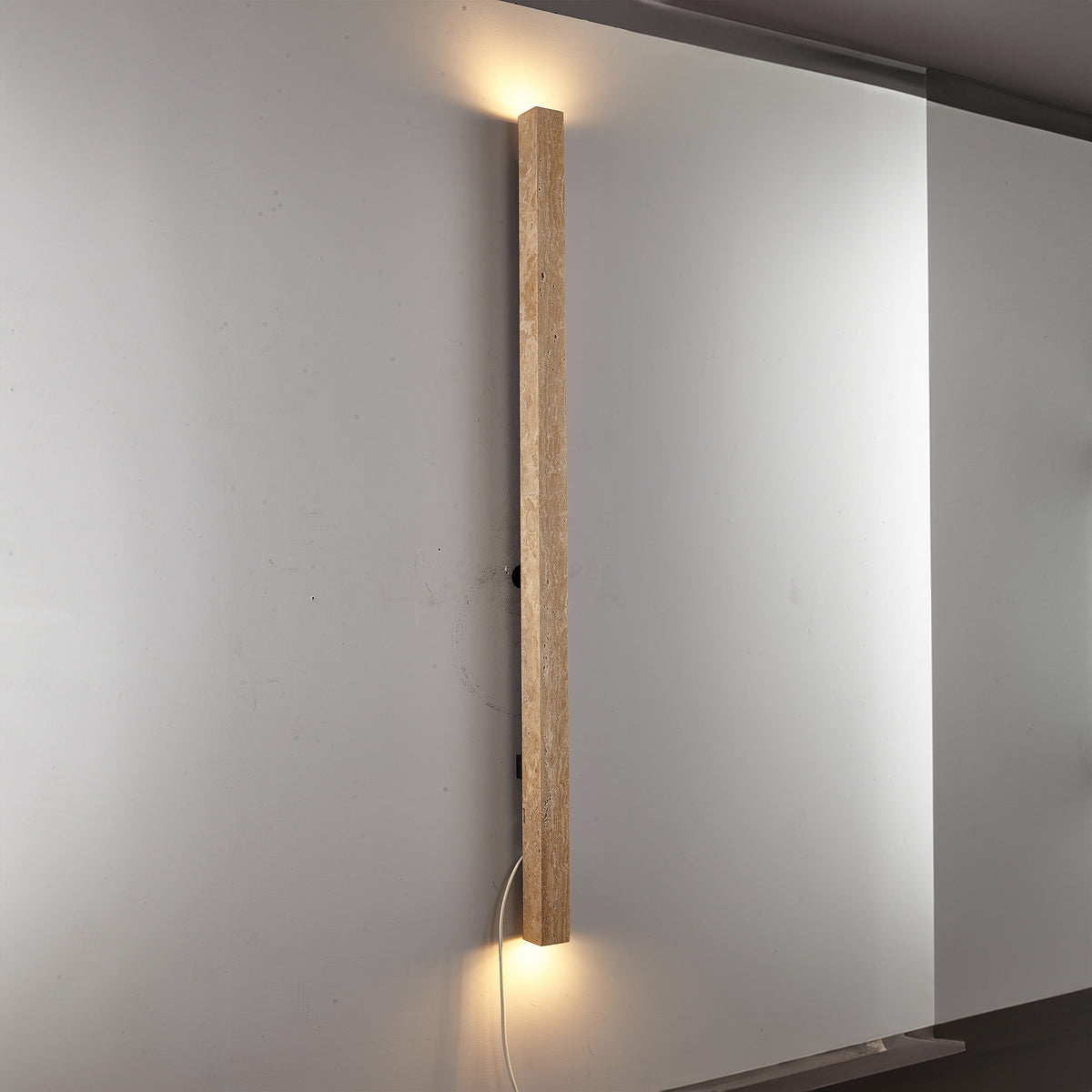 Beige natural travertine marble wall lamp by BEACON, featuring a sleek rectangular design and modern wall-mounted lighting.