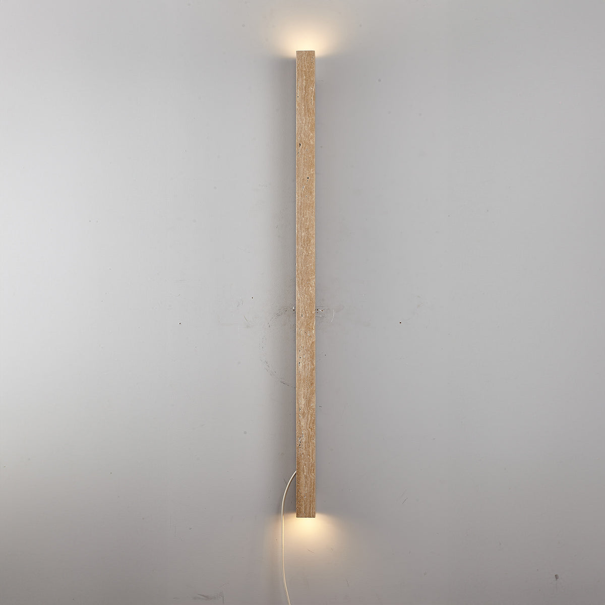 Beige natural travertine marble wall lamp by BEACON, showcasing a stylish wall-mounted light fixture with a smooth marble finish.