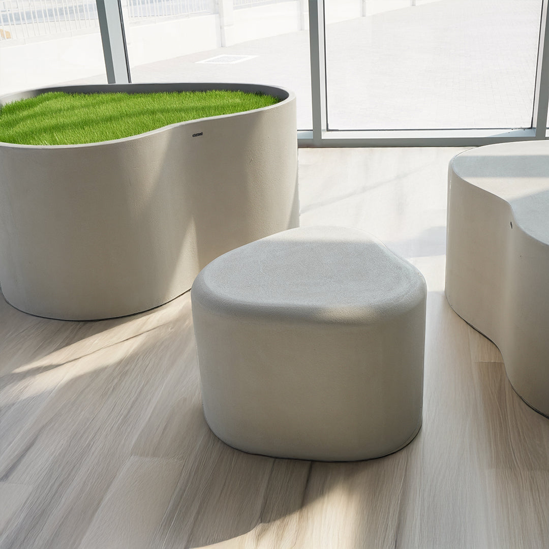 Beige planter box and seating bench by BEACON HWDG, featuring modern design and sturdy construction for outdoor spaces.