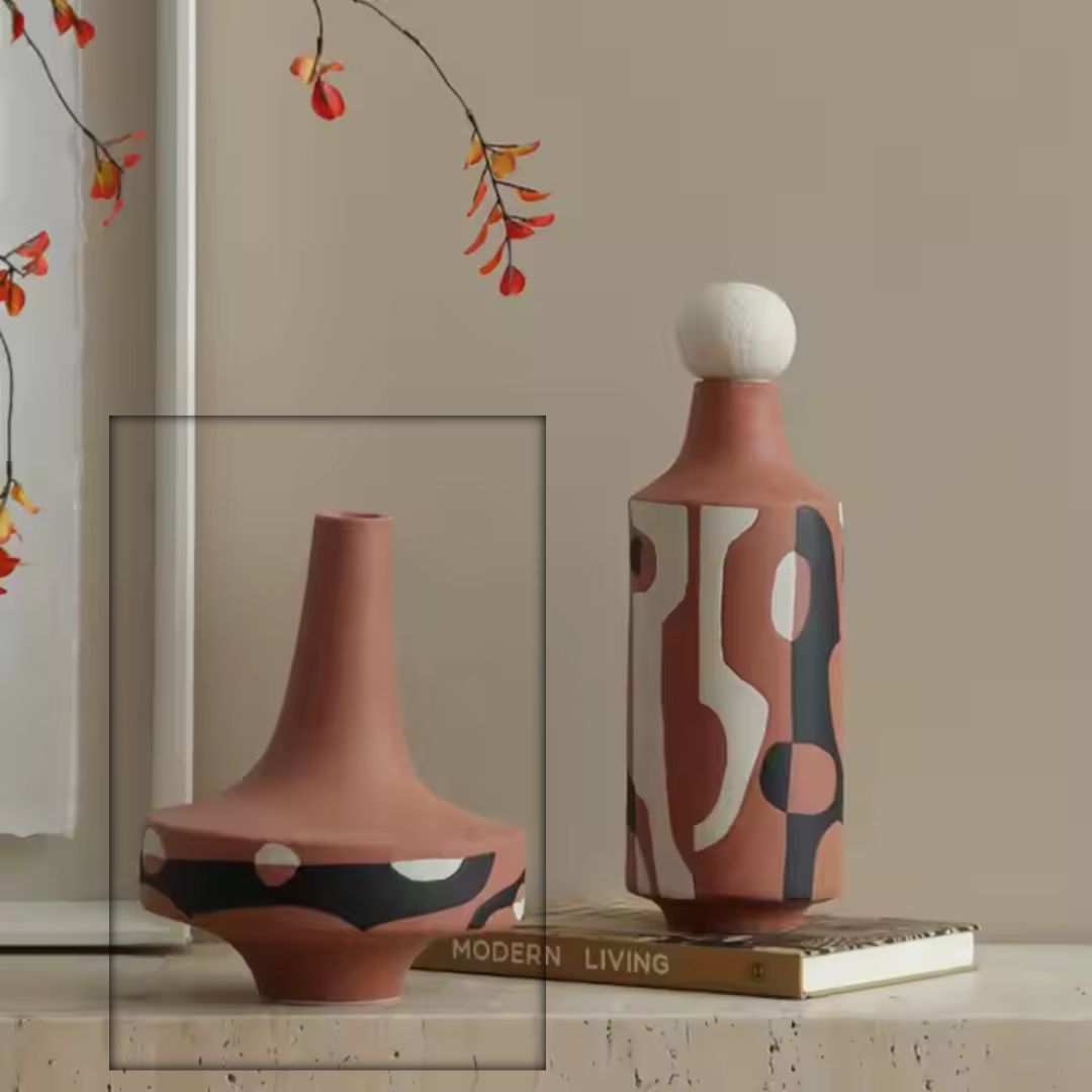 Black and white hand-painted ceramics vase with red accents, featuring artistic floral designs, by BEACON, perfect for decorative display.